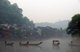 China: Boatmen early morning on Fenghuang's misty Tuo River, Fenghuang, Hunan Province